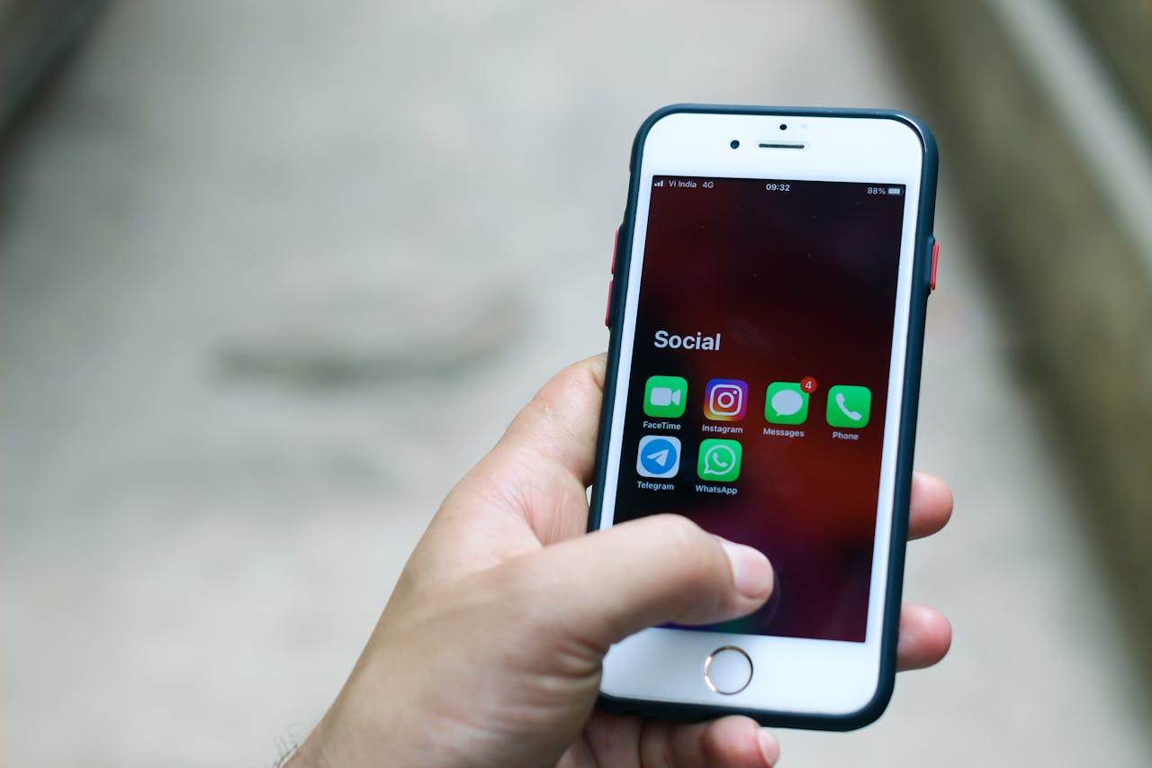 Person Holding Silver Iphone 6